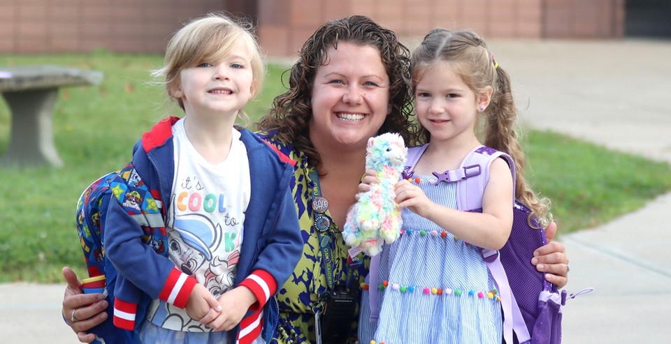 Students and principal smiling (9/2023)