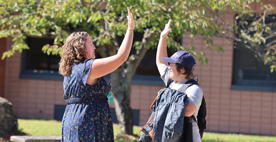 Principal and student high-fiving (9/2024)